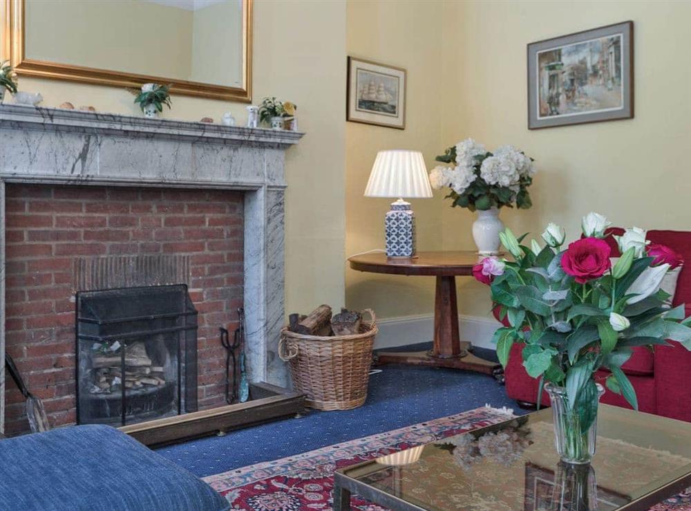 Attractive living room with an open fire (photo 3) at The Old Butlers House in Cley-next-the-Sea, Norfolk., Great Britain