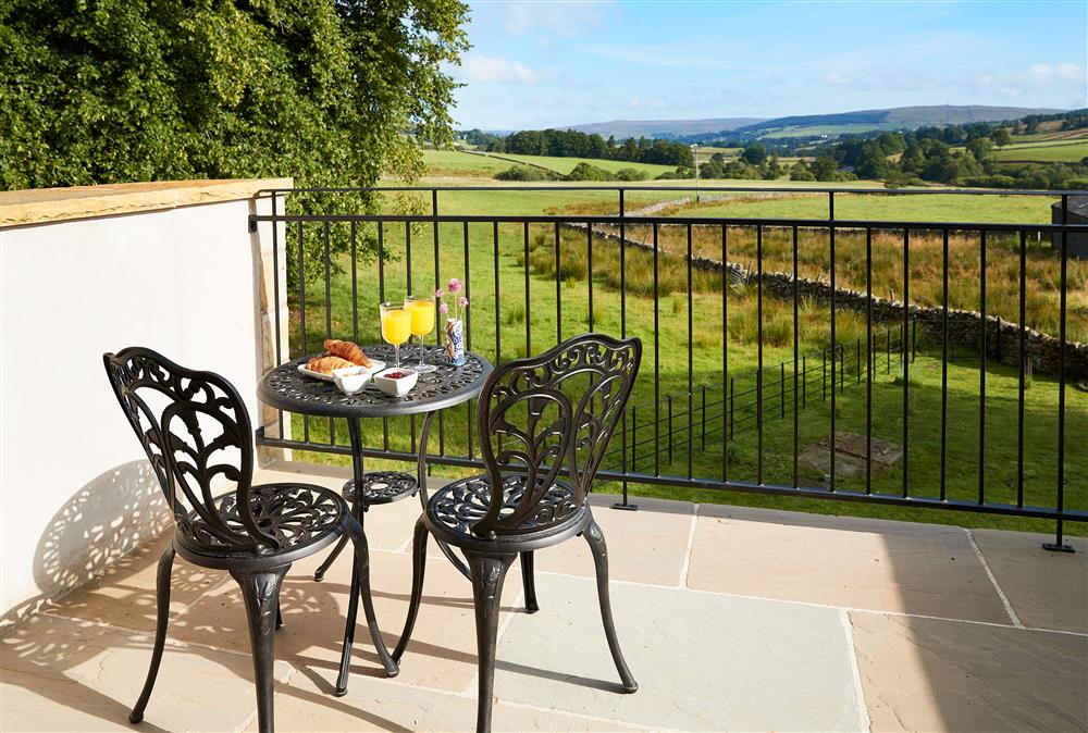 Balcony off the bedroom with bistro table and chairs.  The ideal spot for your morning coffee at The Old Buttress at Rotherhope Towers, Alston