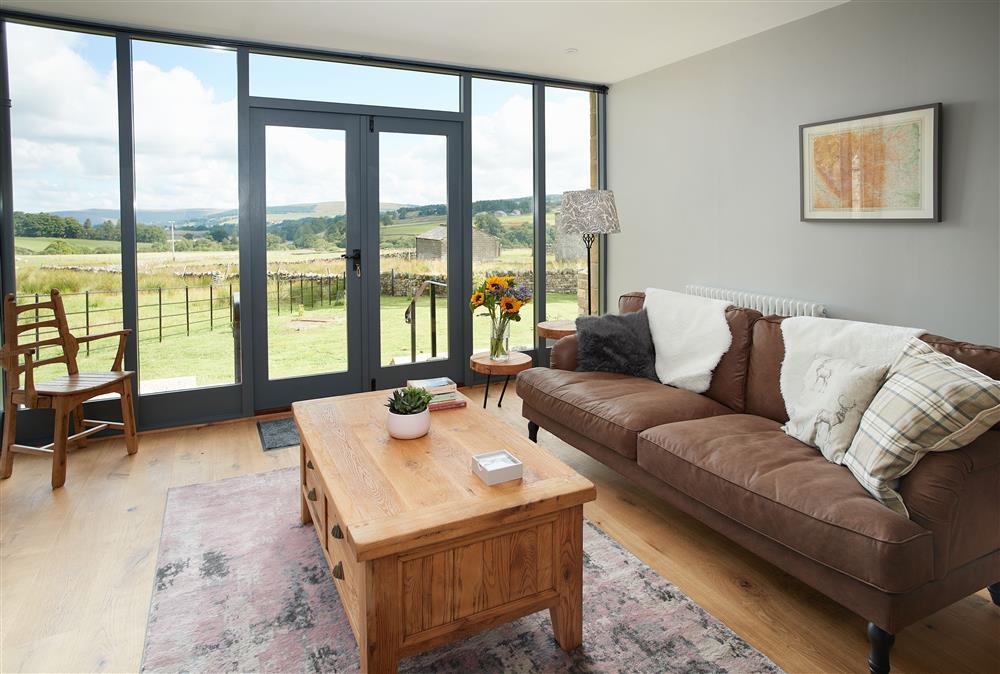 Ground floor: Living space with floor to ceiling windows allowing guests to appreciate the countryside views