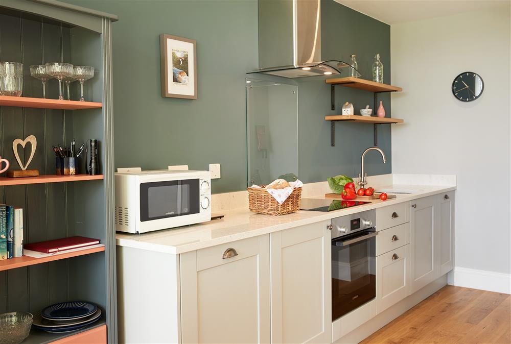 Ground floor: Sleek modern open-plan kitchen at The Old Buttress at Rotherhope Towers, Alston