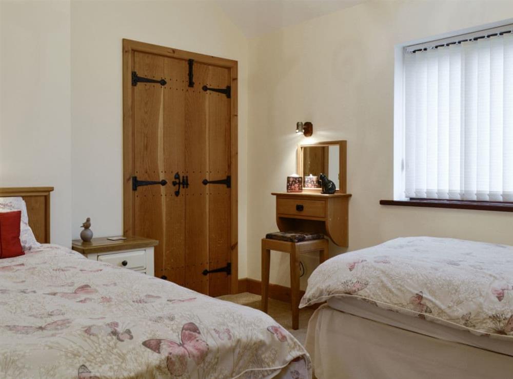 Comfortable twin bedroom at The Old Byre in Dearham, near Maryport, Cumbria