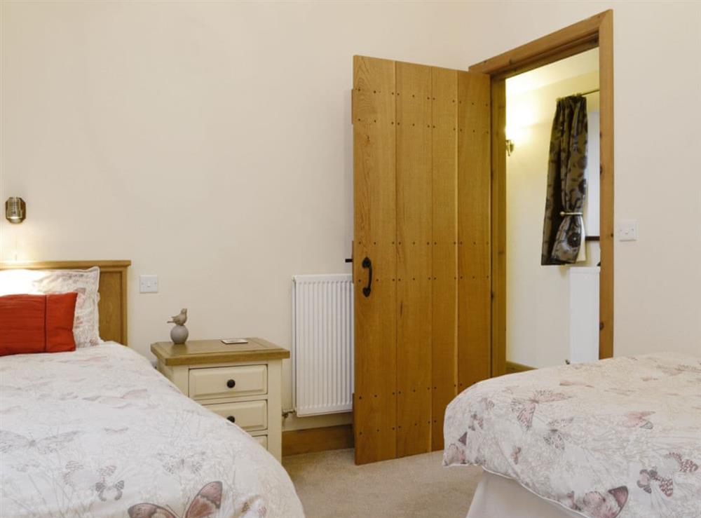 Good-sized twin bedroom at The Old Byre in Dearham, near Maryport, Cumbria