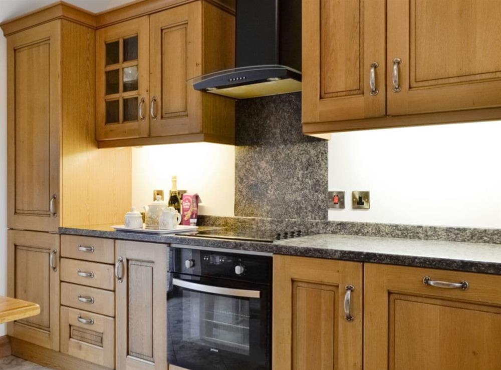 Well-equipped fitted kitchen at The Old Byre in Dearham, near Maryport, Cumbria