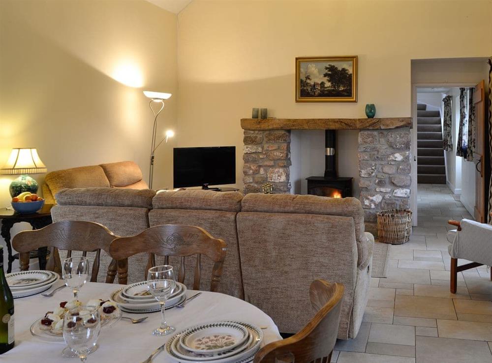Living room and dining area at The Old Byre in Middleton, near Swansea, Glamorgan, West Glamorgan