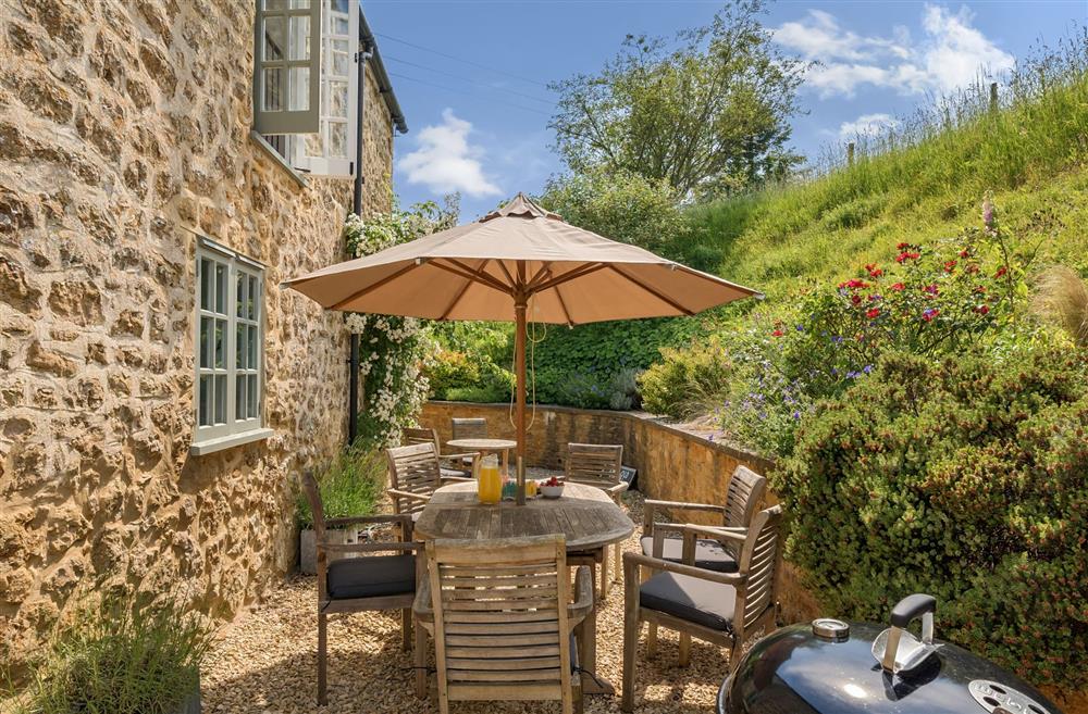 The dining furniture and barbecue at The Old Chapel, Beaminster