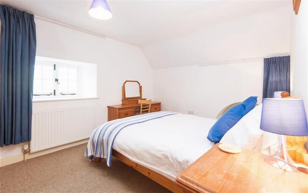 The larger double bedroom is at the front of property at The Old Chapel, Churchill in Axminster