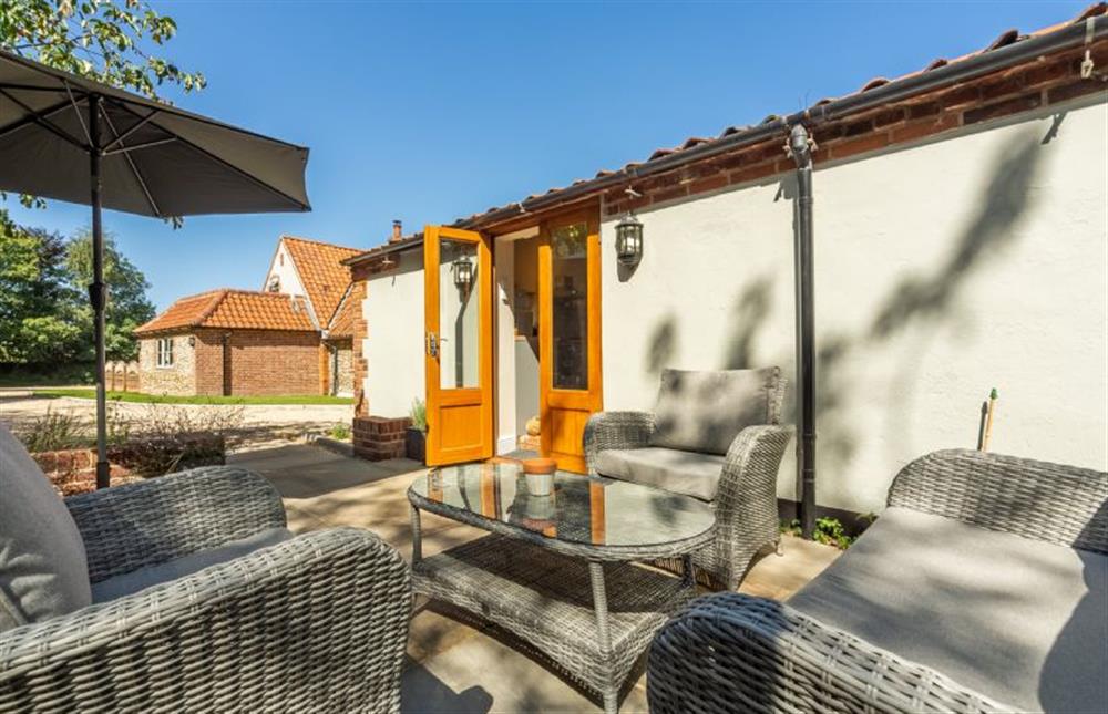 Courtyard with doors into the kitchen/sitting room at The Old Chapel, Great Walsingham