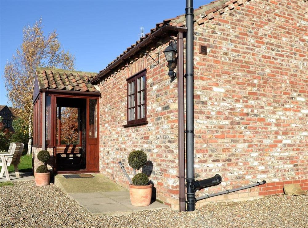 Wonderful cottage with paved patio area in which to soak up the sun at The Old Chapel in Hempholme, near Brandesburton, North Humberside