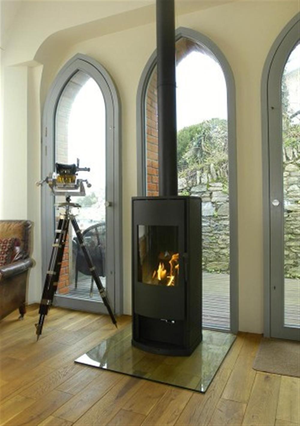 The very efficient flame log effect gas stove. at The Old Chapel in Noss Mayo