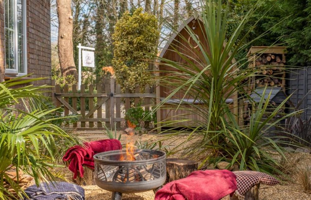 Cosy seating area around the fire pit at The Old Chapel, Pentney near Kings Lynn