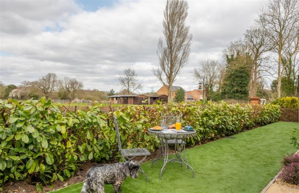 Garden area with bistro table and seating at The Old Chapel, Pentney near Kings Lynn