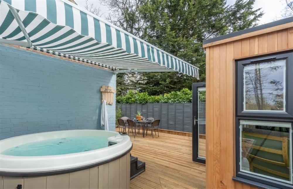 Garden: Hot tub at the rear of the property at The Old Chapel, Pentney near Kings Lynn