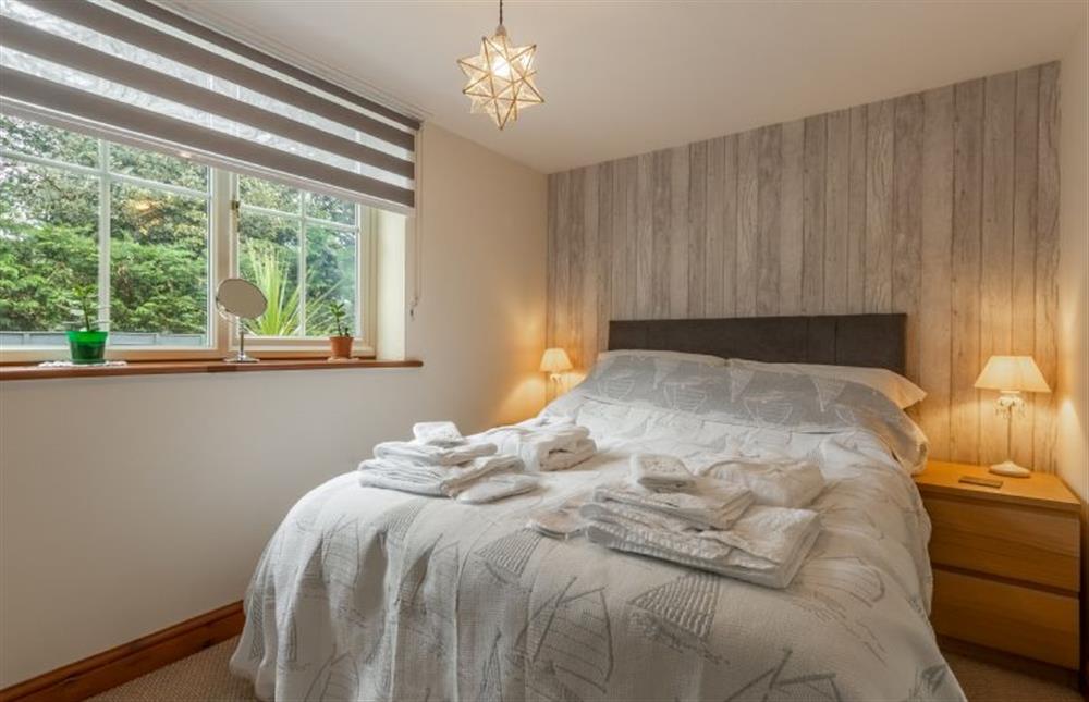 Ground floor: Bedroom three  with double bed and garden views at The Old Chapel, Pentney near Kings Lynn