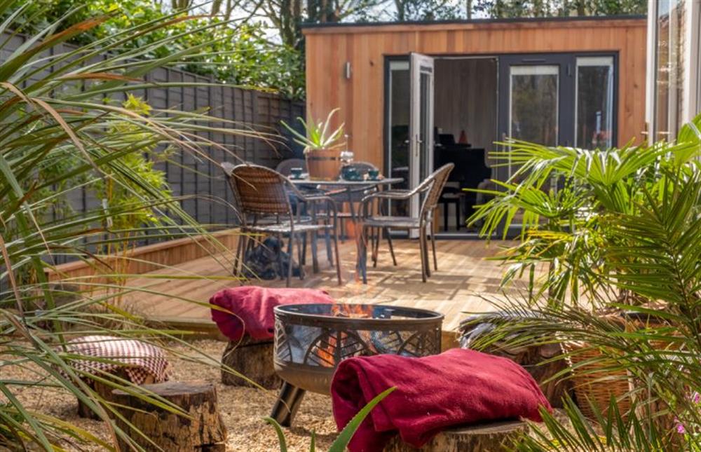 The tropical seating area around the fire pit (photo 2) at The Old Chapel, Pentney near Kings Lynn