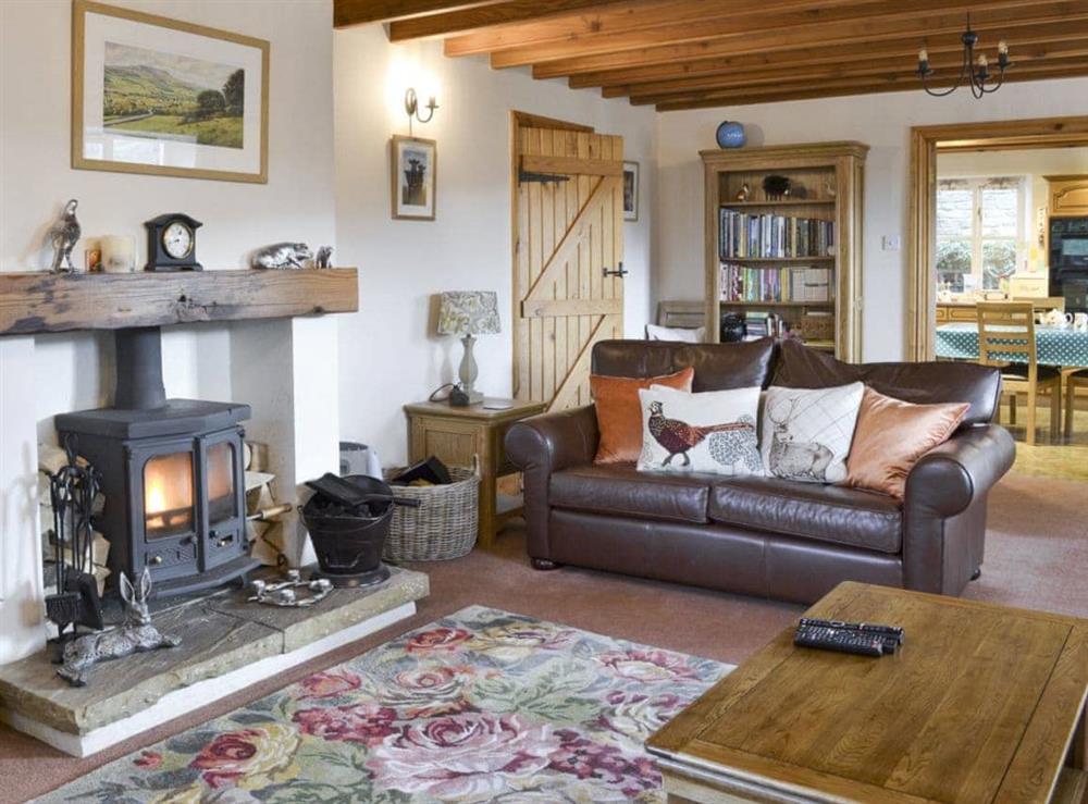 Spacious living room with exposed wooden ceiling beams throughout ground floor at The Old Chapel in Thoralby, near Leyburn, North Yorkshire