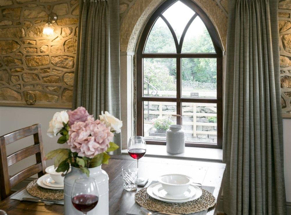 Dining room with unique features at The Old Church in Alton, near Chesterfield, Derbyshire