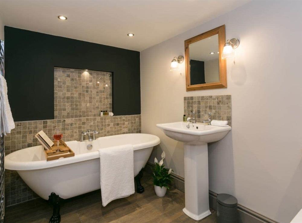 Family bathroom with roll-top bath at The Old Church in Alton, near Chesterfield, Derbyshire