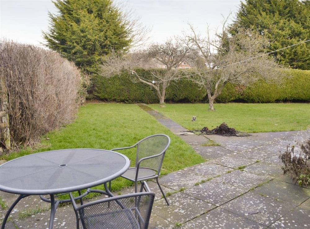 Paved patio with outdoor furniture at The Old Coach House  in Betws-yn-Rhos, near Abergele, Clwyd
