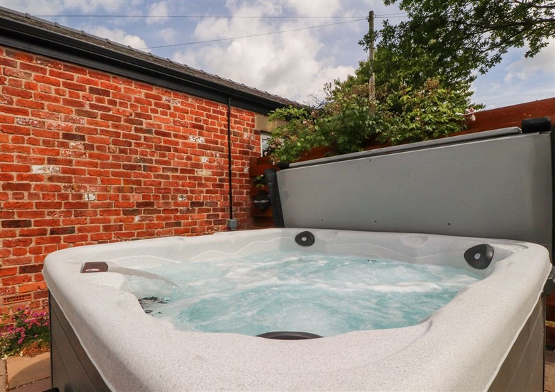 Enjoy the hot tub at The Old Coach House, Bilsborrow