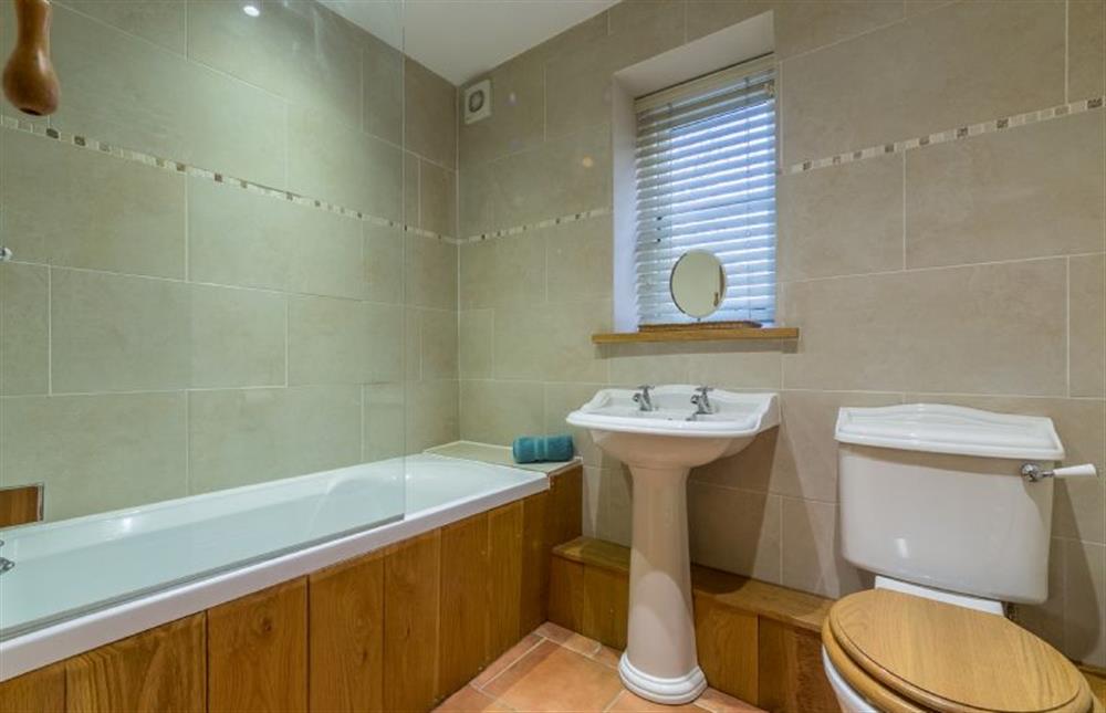Ground floor: Bathroom with shower over at The Old Coach House, Brancaster Staithe near Kings Lynn