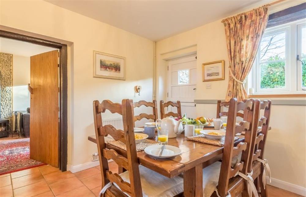 Ground floor: Dining area next to the Sitting room at The Old Coach House, Brancaster Staithe near Kings Lynn