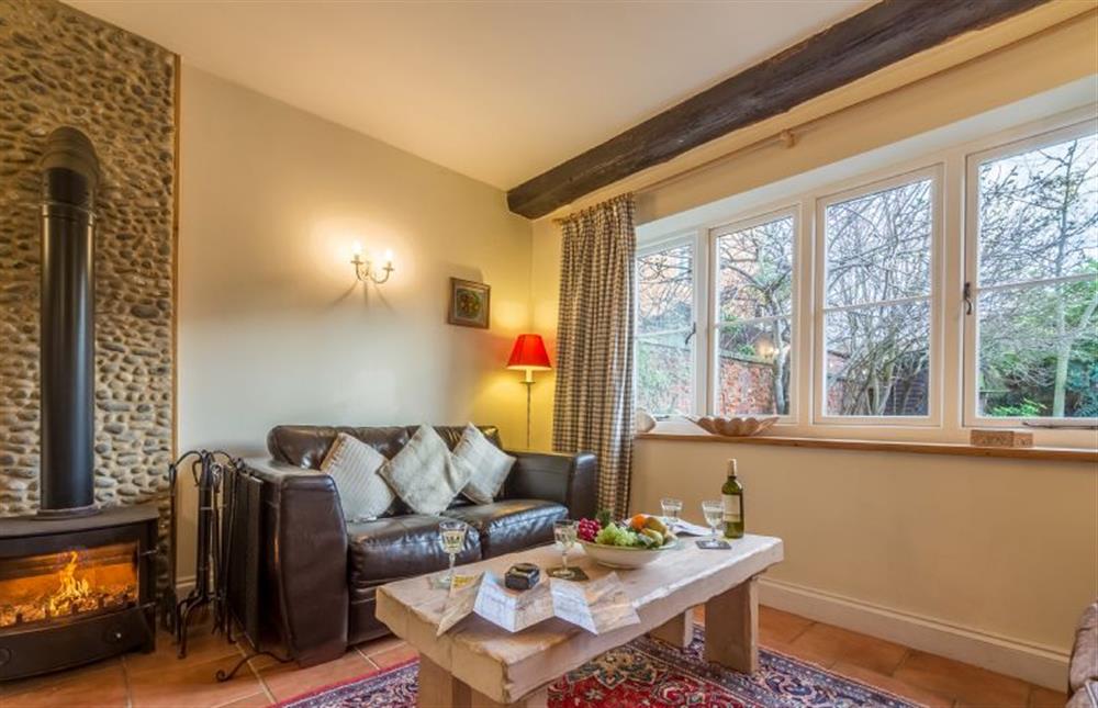 Ground floor: The Sitting room has a cosy wood burning stove