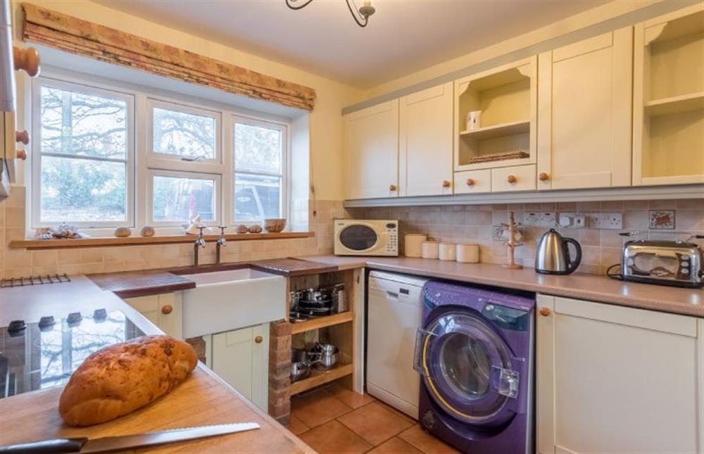Ground floor: The well-equipped Kitchen has Belfast sink at The Old Coach House, Brancaster Staithe near Kings Lynn