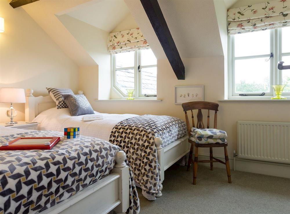 Pretty twin bedroom at The Old Coach House in Colyton, near Honiton, Devon