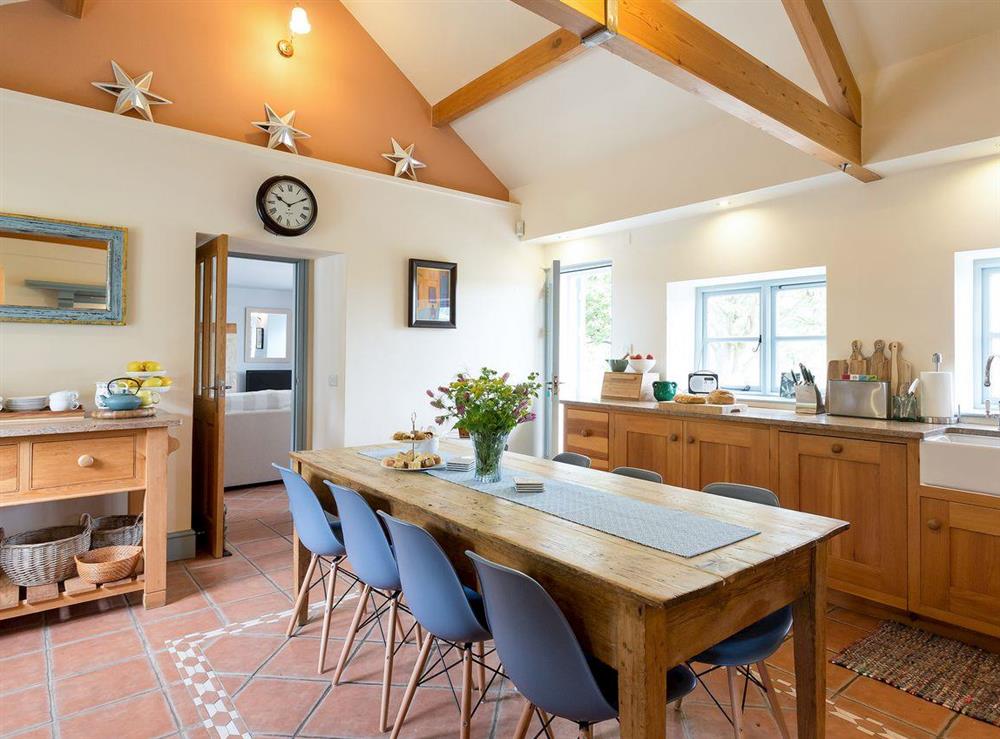 Spacious farmhouse style kitchen with large family sized dining table (photo 2) at The Old Coach House in Colyton, near Honiton, Devon