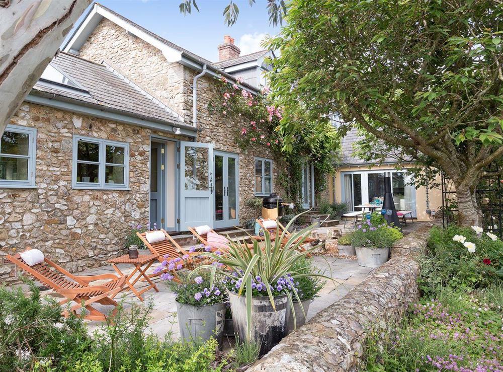 Take advantage of the outdoor eating area and the BBQ for an alfresco dining experience at The Old Coach House in Colyton, near Honiton, Devon