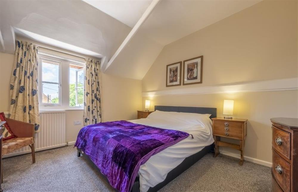 Bedroom two with 5’ king-size bed at The Old Coach House, Congham near Kings Lynn