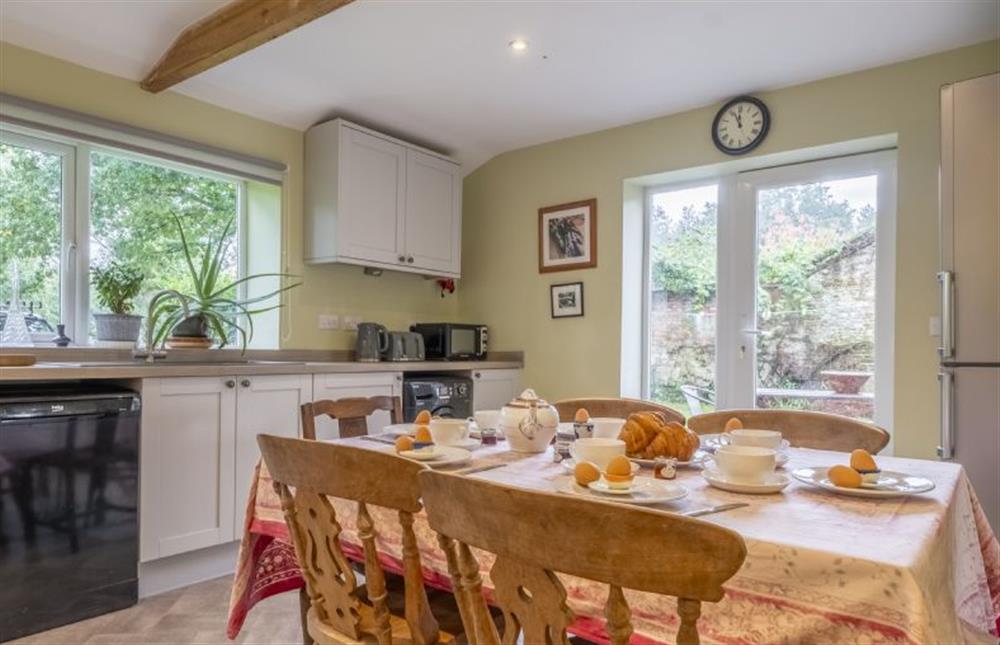 Kitchen with breakfast table and direct access to the rear garden at The Old Coach House, Congham near Kings Lynn