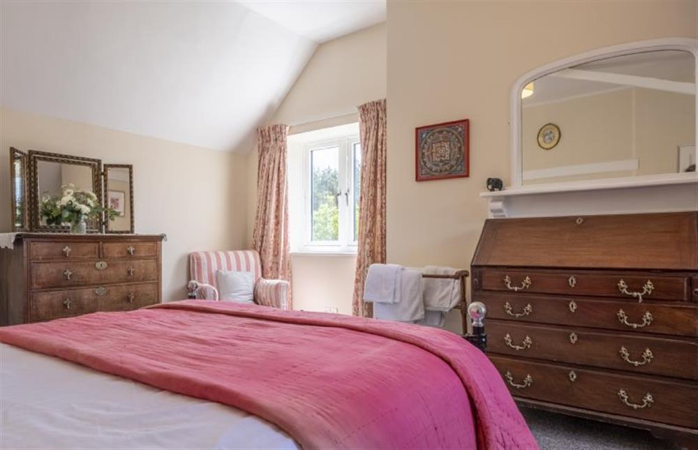 Master bedroom with 5’ king-size bed (photo 2) at The Old Coach House, Congham near Kings Lynn