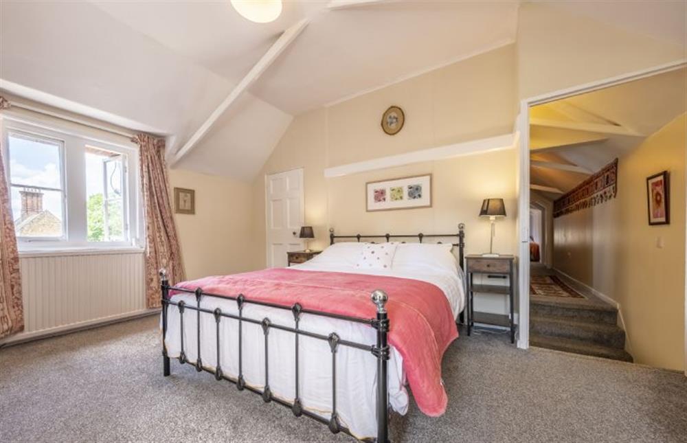Master bedroom with 5’ king-size bed at The Old Coach House, Congham near Kings Lynn