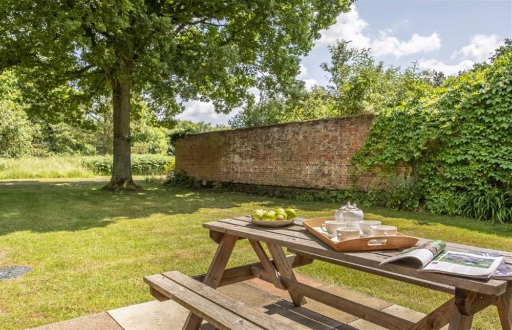 Picnic table and charcoal barbecue at The Old Coach House, Congham near Kings Lynn