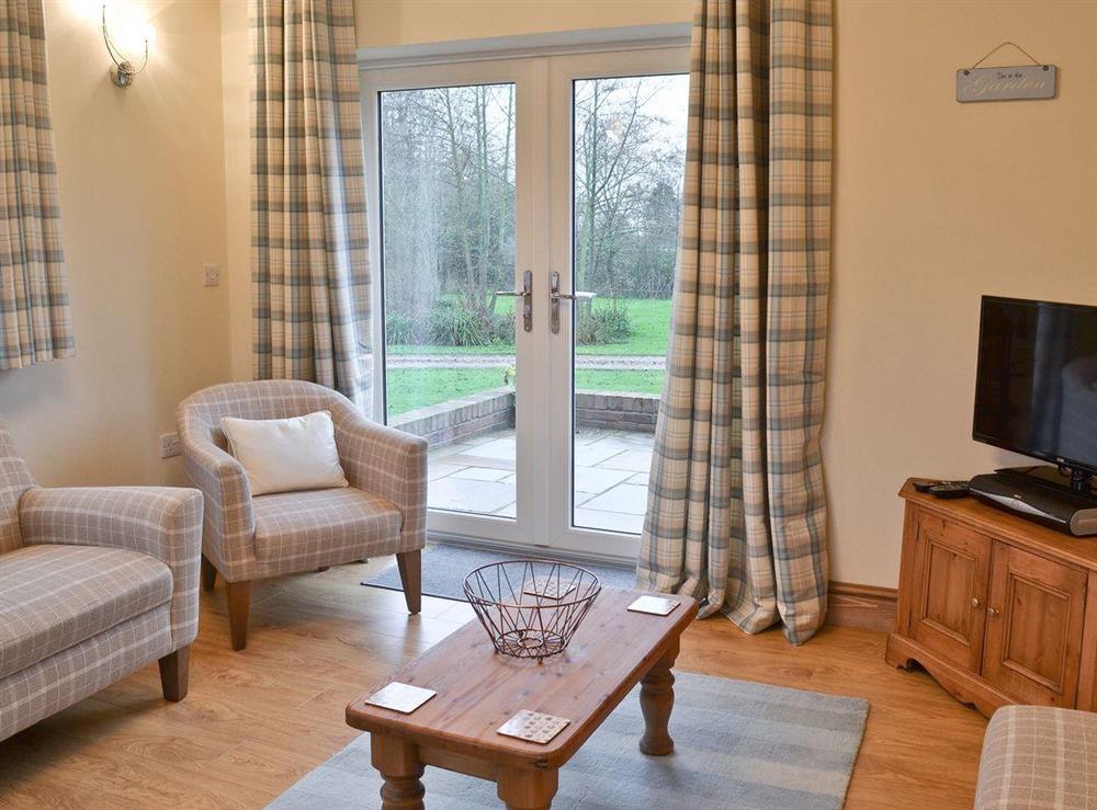 Open plan living room with patio doors (photo 2) at The Old Coach House in Driffield, North Humberside