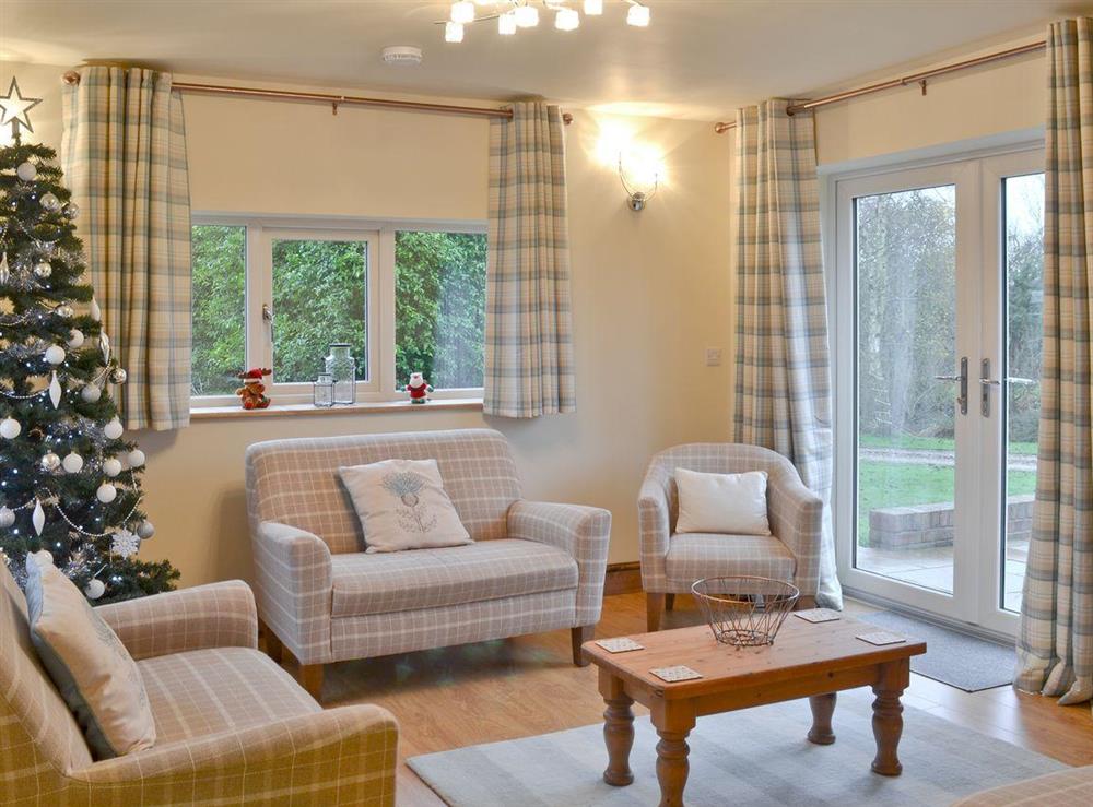 Open plan living room with patio doors at The Old Coach House in Driffield, North Humberside