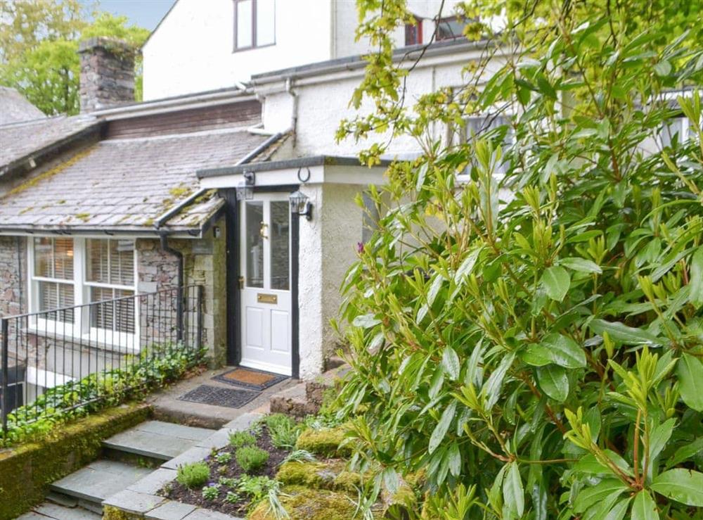 Slate steps and lush gardens adorn the property at The Old Coach House in Grasmere, Cumbria