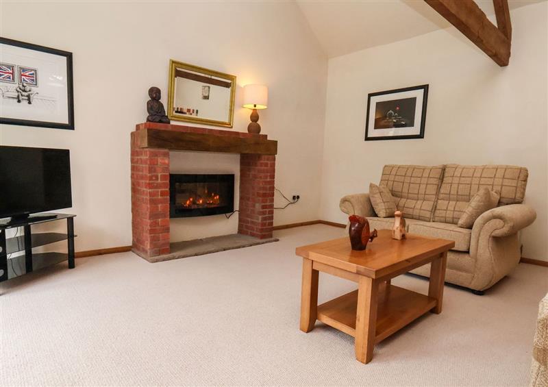 Relax in the living area at The Old Coach House, Thornton-Le-Dale