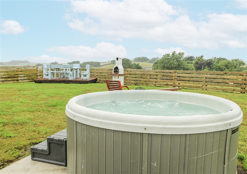 Relax in the hot tub at The Old Cornmill, Cemaes Bay