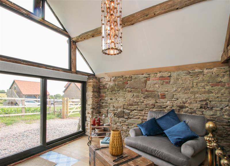 Relax in the living area at The Old Cow House, Wheathill near Ditton Priors