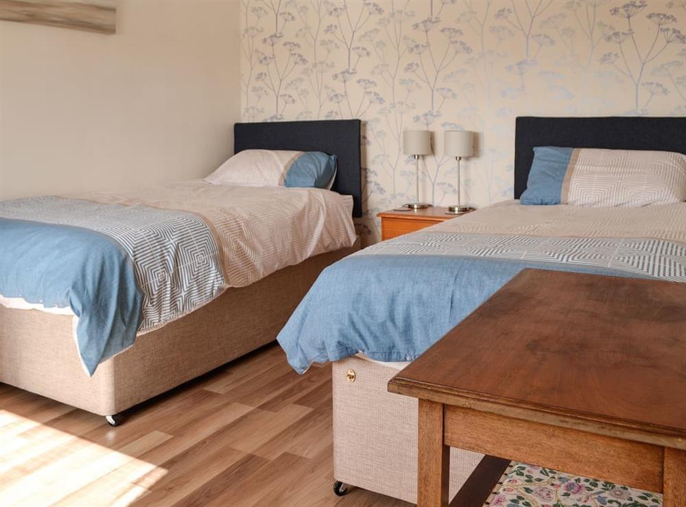 Twin bedroom at The Old Cow Shed in Wickwar, Wotton-under-Edge, Gloucestershire