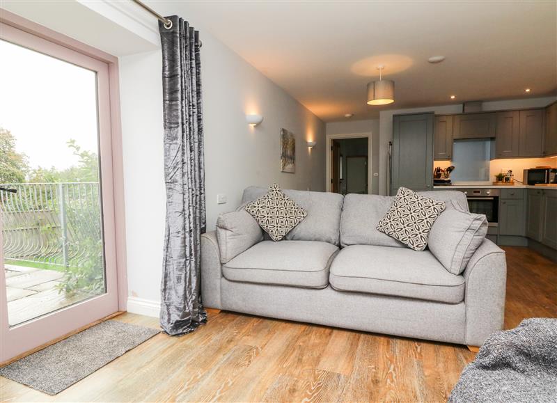 Relax in the living area at The Old Cowshed, Broadwoodwidger near Lifton