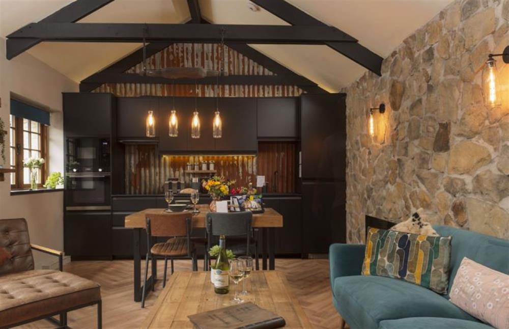 Complete with exposed stone walls, vaulted ceilings, rustic tin sheeting and exposed roof trusses.