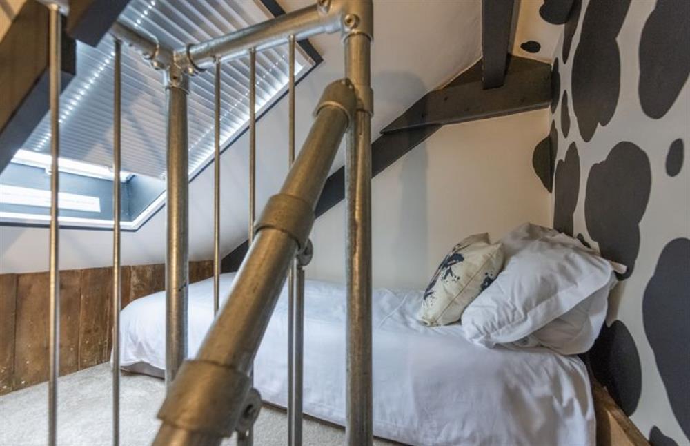 Stairs lead to the mezzanine level which offers two single mattresses. (Only suitable for children or young teenagers, please take caution on the stairs)