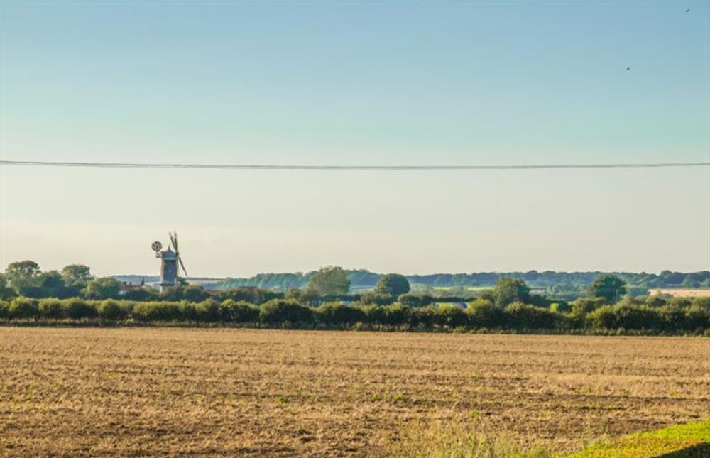 A view across the fields to Bircham Windmill which you can visit and purchase flour ... you can even climb to the top if youftre not of a nervous disposition!