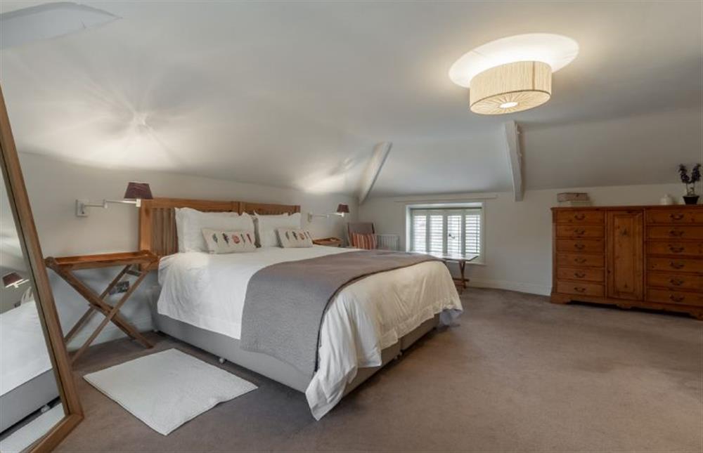 First floor: Master bedroom is characterful yet still light and bright at The Old Dairy, Great Bircham near Kings Lynn