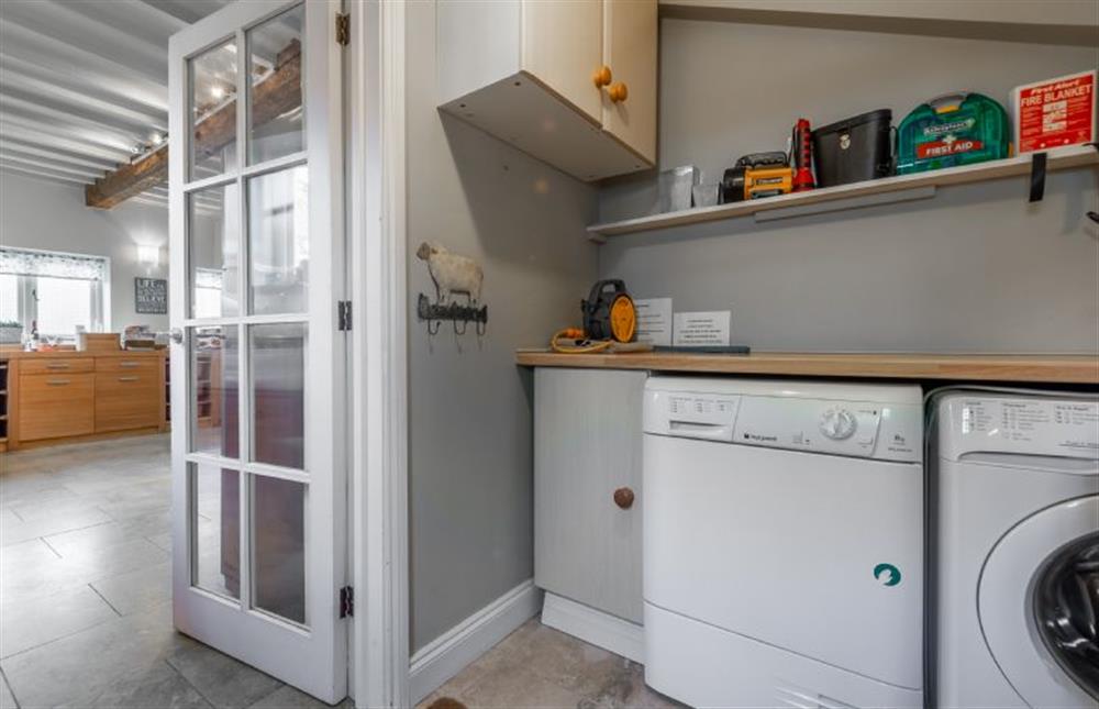 Ground floor: Practical utility room with washing machine and tumble dryer and space for coats and boots 