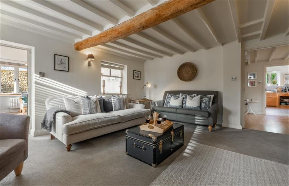 Ground floor: The sitting room has two comfy sofas, perfect for curling up on at The Old Dairy, Great Bircham near Kings Lynn