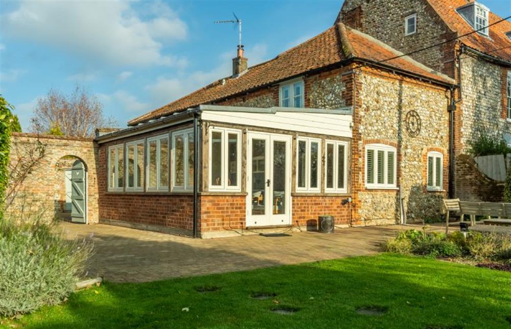 The conservatory/garden room offers wonderful views of the cottage walled garden at The Old Dairy, Great Bircham near Kings Lynn